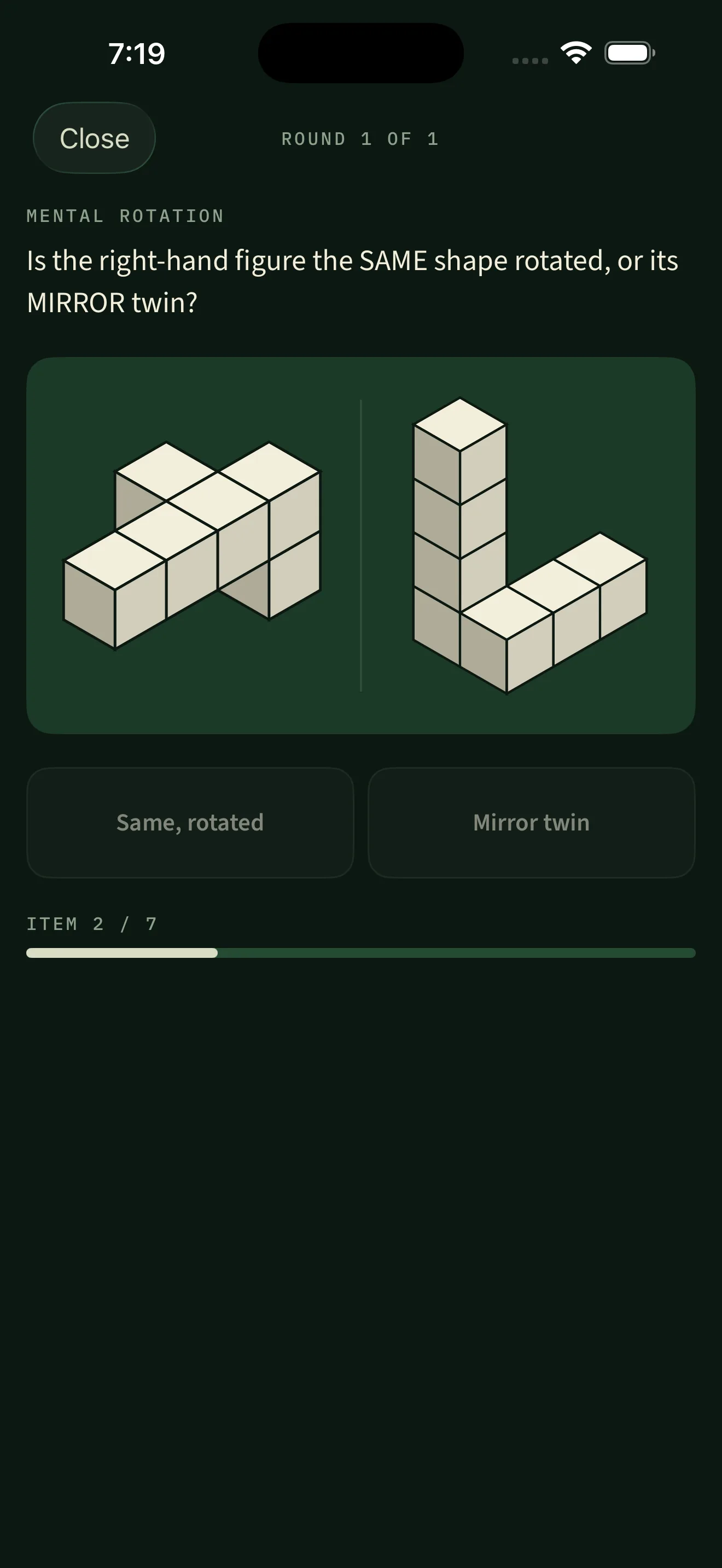 A mental rotation round asking whether the right-hand block figure is the same shape rotated or its mirror twin, two isometric cube figures side by side above the two answer buttons