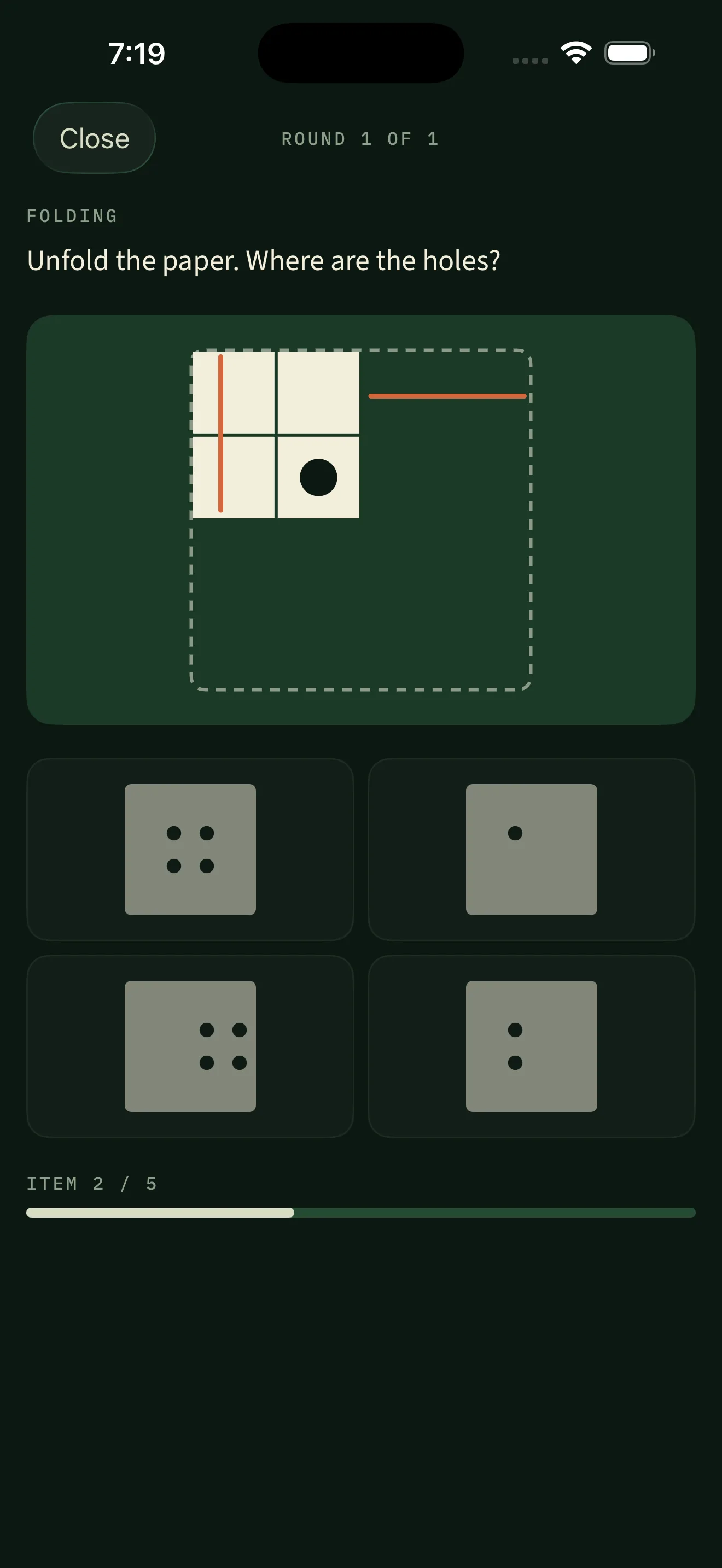 A paper-folding round: a square sheet folded twice with one hole punched, and four unfolded answer options showing different hole patterns